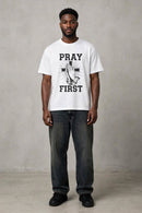 White Pray First T-shirt by Kingdom Mind Apparel featuring a simple, clean design with the "Pray First" message on the front.