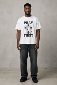 White Pray First T-shirt by Kingdom Mind Apparel featuring a simple, clean design with the "Pray First" message on the front.
