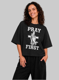 Black Pray First T-Shirt by Kingdom Mind Apparel featuring bold prayer-themed design on soft cotton fabric.