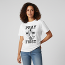 Female model wearing Pray First White Tee