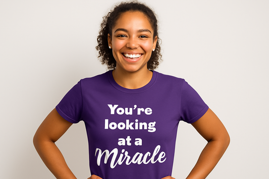 Female model wearing purple miracle shirt
