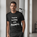 Male model in black miracle shirt - no crown