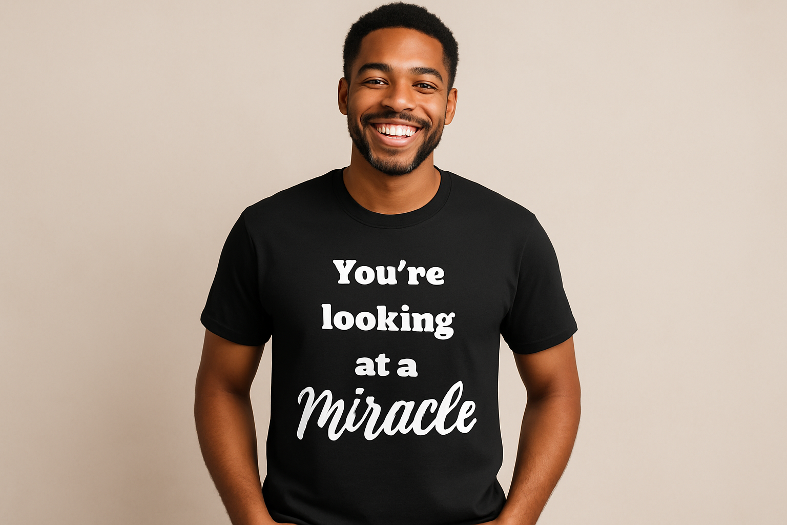 Male model mockup with arms unfolded wearing the "You're looking at a Miracle" t-shirt