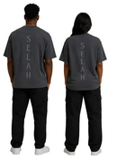 Back view of male and female models wearing Kingdom Mind Apparel's Selah T-Shirt with printed design on the back.