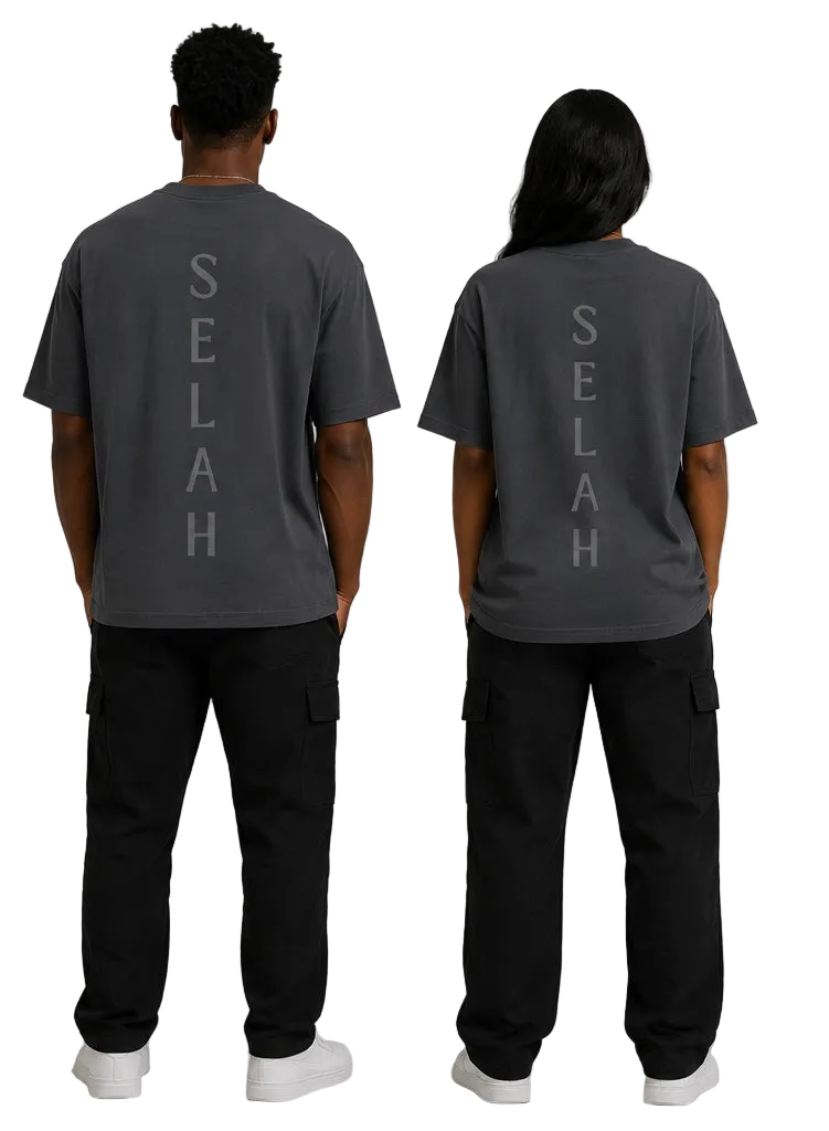 Back view of male and female models wearing Kingdom Mind Apparel's Selah T-Shirt with printed design on the back.